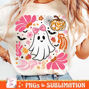 May include: A white ghost with a pink bow, a pumpkin with orange and white stripes, and pink and orange flowers on a white background. This design is perfect for Halloween.