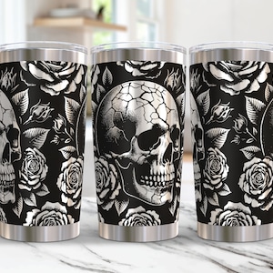 May include: Three stainless steel tumblers with a black and white skull and rose pattern. The tumblers are insulated and have a double-walled design.