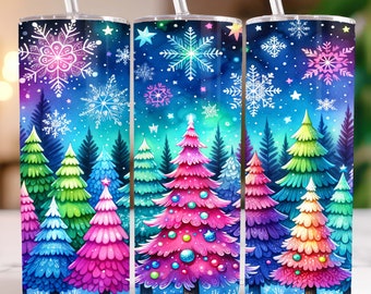 May include: Three colorful Christmas tree designs on a blue background with snowflakes and stars. The trees are decorated with ornaments and lights. The designs are printed on a white tumbler with a straw.
