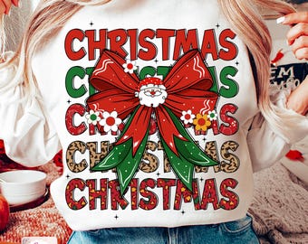 Puede incluir: Sudadera blanca con un diseño navideño rojo y verde con un lazo, Papá Noel y la palabra "Navidad" repetida en diferentes patrones.
