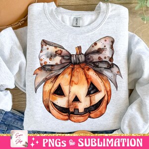 May include: A watercolor illustration of a jack-o'-lantern pumpkin with a brown and white polka dot bow. The pumpkin is orange with a black face and is on a gray background.