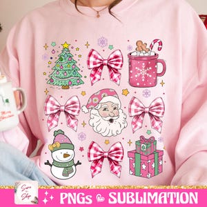 May include: Pink Christmas sublimation design featuring a Christmas tree, Santa Claus, a snowman, a bow, a mug of hot chocolate, and a gift box.  The design is perfect for creating custom apparel, mugs, and other items.