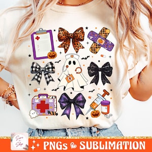 May include: A white t-shirt with a Halloween-themed design featuring a ghost, a first aid kit, a syringe, a bow, a bandage, and a pumpkin. The design is in a cartoon style and includes the words "PNGS SUBLIMATION".