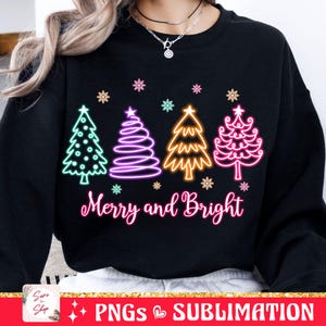 May include: Black sweatshirt with a neon design of Christmas trees and the text "Merry and Bright".