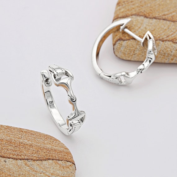 Sterling silver snaffle huggie earrings. Sterling silver snaffle huggie earrings.