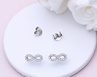 Pendientes de plata de ley y circonita cúbica con forma de infinito (No se admiten devoluciones)