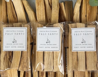 May include: Three packages of Palo Santo sticks, each with a label that reads "Mellow Moon Crystals" and "Purify, Soothe, Energize." The sticks are light brown and arranged in bundles.