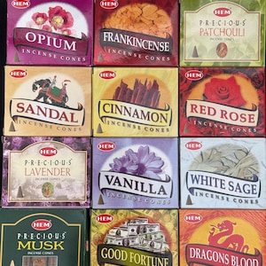 May include: Twelve different incense cone boxes with various scents, including Opium, Frankincense, Sandal, Cinnamon, Red Rose, Lavender, Vanilla, White Sage, Musk, Good Fortune, and Dragons Blood. Each box features a colorful design and the HEM brand logo.