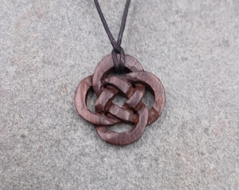 Beautifully handmade Celtic Knot pendant made from recycled wood hung on a adjustable waxed cotton thong and measuring 3cm