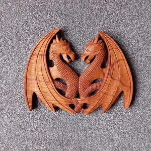 Hand carved Double Dragon plynth that has been coloured and polished to a wonderfully smooth finish with dark beeswax.