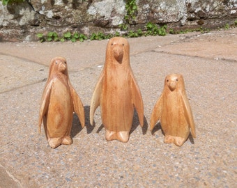 Cute indivdually handmade wooden penguin family carved and polished to a high quality finish available as a family or individually.