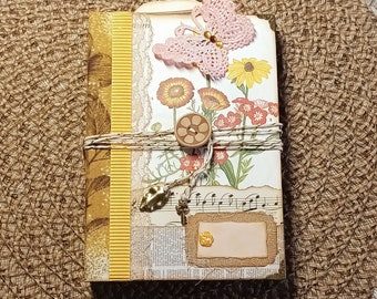 Junk Journal handmade in floral vintage style with various papers for journaling, souvenir or travel notebook, ephemera collection