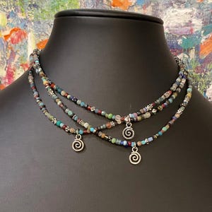 Differet lengths available. Colorful small beaded choker w/smallsilver swirly charm. Unisex, hippie Boho Made to order. Price for 1 necklace