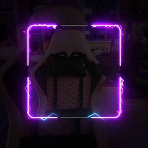 May include: A white and black gaming chair with a black headrest pillow. The chair is framed in a neon pink and blue border.