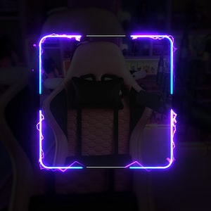 May include: A white and black gaming chair with a pink and black patterned back. The chair has a black headrest and a black lumbar support. The chair is framed with a neon blue and pink border.