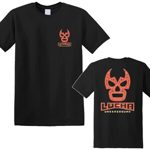 May include: Two black t-shirts with a red and orange luchador mask graphic and the text "LUCHA UNDERGROUND".