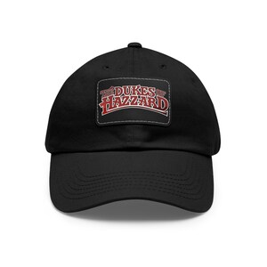 May include: Black baseball cap with a red and white embroidered patch that says "The Dukes of Hazzard".