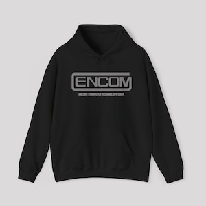 May include: A black hooded sweatshirt featuring a front kangaroo pocket and long sleeves. The chest displays the grey text ENCOM enclosed in a rectangular border, with the words ENCOM COMPUTER TECHNOLOGY CORP. printed in smaller grey text below.