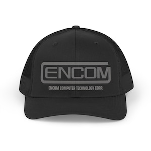 May include: Black trucker hat with a mesh back and a curved brim. The front of the hat features the word "ENCOM" in a gray, stylized font, with "ENCOM COMPUTER TECHNOLOGY CORP." printed below.