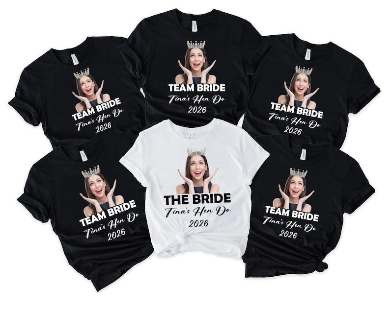 May include: A collection of five short-sleeved t-shirts, four black and one white, each featuring a photographic print of a person wearing a crown with hands near their face. The black shirts read TEAM BRIDE, while the white shirt reads THE BRIDE, all with Tina's Hen Do 2026.