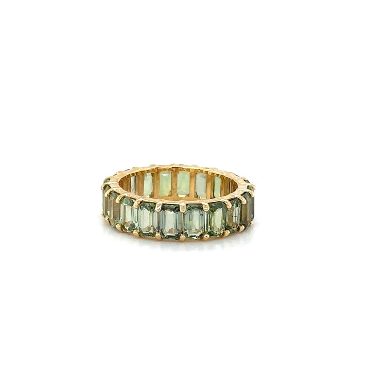 May include: A gold ring featuring a continuous band of rectangular, light green gemstones. The ring's band is a warm gold color, and the gemstones are evenly spaced around the circumference, creating a full eternity design.
