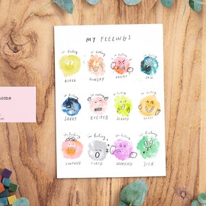 Puede incluir: Un gr&aacute;fico imprimible con el t&iacute;tulo "Mis sentimientos" que presenta 12 caras de dibujos animados coloridas que representan diferentes emociones. Cada cara est&aacute; etiquetada con un sentimiento, como "aburrido", "hambriento", "enojado", "triste", "lo siento", "emocionado", "asustado", "feliz", "confundido", "cansado", "preocupado" y "enfermo".