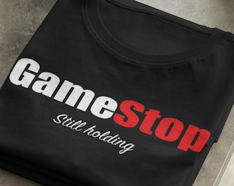 Gamestop tshirt | Gamestonk t shirt | GME shirt | Still holding | Funny gifts | Stock market tshirt | Gift for stock market enthusiasts.