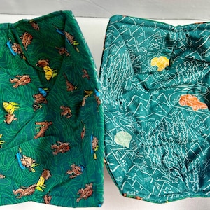 May include: A white ceramic mug with a black handle and the text "But First, Coffee" in a bold, black font. The mug is displayed on a white surface, highlighting its simple design.