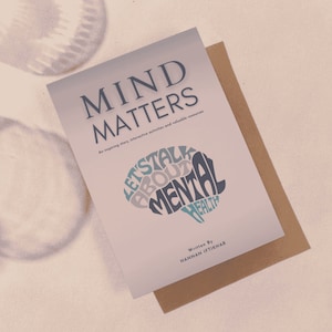 Puede incluir: Un libro titulado "Mind Matters" con un gráfico en forma de cerebro que dice "Let's Talk About Mental Health". El libro está escrito por Hannan Iftikhar.