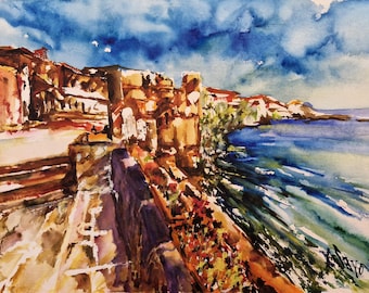 May include: Watercolor painting of a coastal town with buildings along a cliff overlooking a blue sea. The sky is a bright blue with white clouds. The painting is done in a loose, impressionistic style.