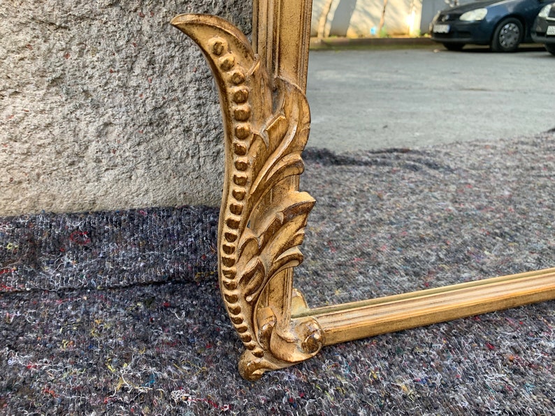 Fully hand casted, handcarved by our experienced engravers.Made of solid wood from linden tree and some carving parts are made of hornbeam wood. 4mm glass mirror will be also attached on the frame.