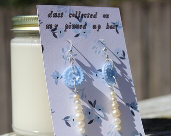 the 'dust collected on your pinned up hair' evermore earrings