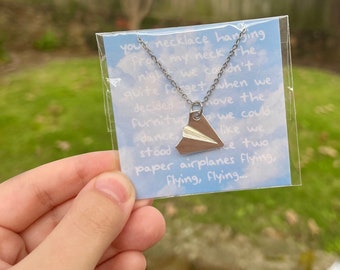 paper airplane necklace / 1989 (taylor's version) / out of the woods (tv)