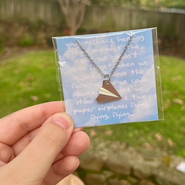 paper airplane necklace / 1989 (taylor's version) / out of the woods (tv)