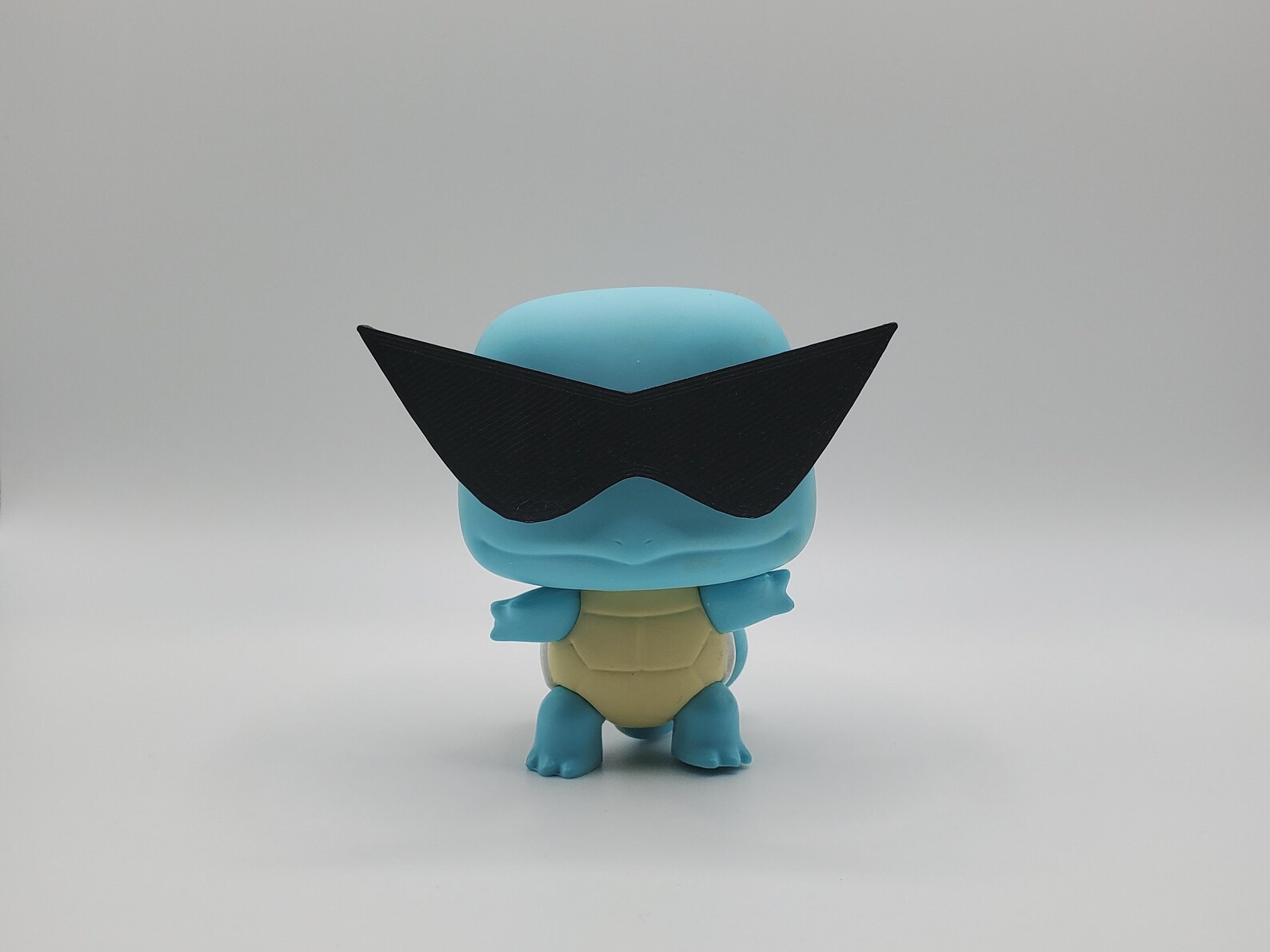squirtle funko pop with glasses