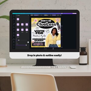 May include: A computer monitor displays a graphic design with the text "DON'T BE Clueless" and "VOTE FOR Malia Kyle HOMECOMING QUEEN". The design features a photo of a woman in a yellow cardigan. The screen also shows a design program interface.