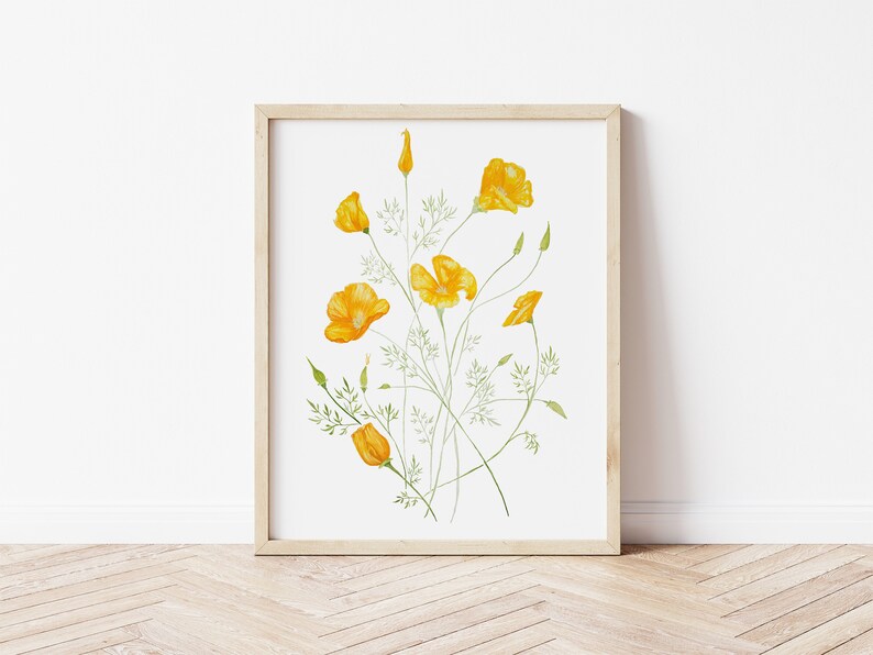 May include: A framed print of a watercolour painting of a bouquet of yellow California poppies with green stems and leaves on a white background.