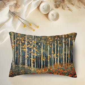 May include: Rectangular decorative pillow featuring a forest scene with tall, slender trees and colorful foliage. The pillow has a dark blue background with orange, yellow, and green accents. The pillow is designed to be used as a decorative accent.