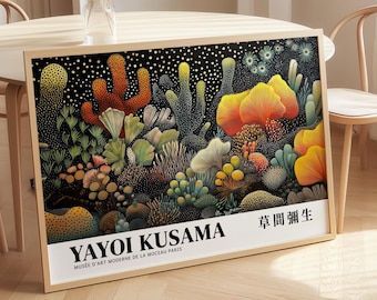 May include: A framed art print featuring a colorful, abstract illustration of various plant forms in shades of orange, yellow, green, and white against a black background. The print includes the text "YAYOI KUSAMA" and Japanese text. The frame is made of light-colored wood.