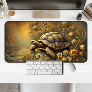 May include: A gold and brown patterned mousepad with a detailed image of a turtle with a gold shell and intricate floral designs.