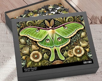 May include: A 500 piece jigsaw puzzle featuring a green luna moth with large eyes, surrounded by intricate floral designs. The puzzle box is black with the text "16x20 Puzzle 500 pcs. Ages 9+"