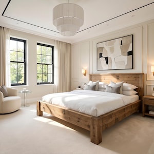 May include: A bedroom with a rustic wooden bed frame, white bedding, and grey pillows. The room has large windows with black frames, beige curtains, and a neutral colour scheme. An abstract painting hangs above the bed, and a chandelier hangs from the ceiling.