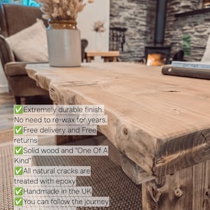 May include: A close-up of a wooden table with a natural, rustic finish. The table is made of solid wood and has a unique, one-of-a-kind character. The table is treated with epoxy to protect it from cracks and damage. The table is handmade in the UK and is available for purchase on Instagram @tribe.joinery.