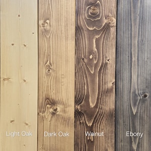 May include: Four wood samples showing different wood stains: light oak, dark oak, walnut, and ebony.