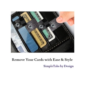 May include: A black leather wallet with a built-in card holder. The card holder has tabs that allow you to easily remove cards. The text "SimpleTabs by Design" is printed on the bottom of the image.