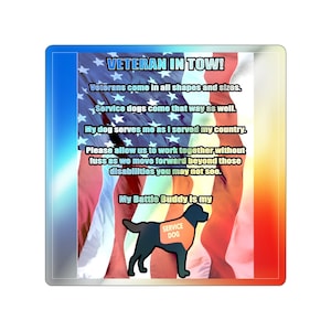 May include: A sticker with an American flag background and a black Labrador Retriever service dog. The text on the sticker reads "Veteran in Tow! Veterans come in all shapes and sizes. Service dogs come that way as well. My dog serves me as I served my country. Please allow us to work together without fuss as we move forward beyond those disabilities you may not see. My Battle Buddy is my". The dog is wearing a vest that says "Service Dog".
