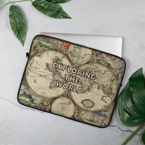 May include: A laptop sleeve with a vintage world map design. The map is in shades of brown, green, and blue. The text "EXPLORING THE WORLD" is printed in black on the sleeve.