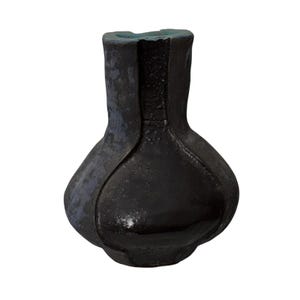 May include: A dark charcoal black ceramic vase with a bulbous body and a narrow neck. The surface features a textured, matte finish with vertical recessed channels running from the rim to the base, revealing a subtle blue interior glaze.