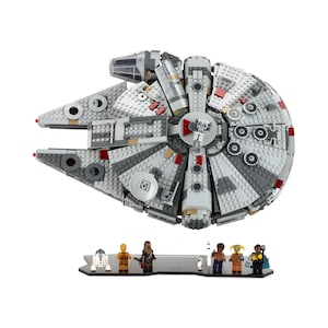 May include: A grey and white LEGO Millennium Falcon spaceship with red accents. The spaceship is on a black display stand with six minifigures.