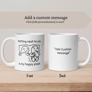 May include: Two white ceramic mugs. The front mug has a black and white cartoon couple with the text "Rotting next to you is my happy place." The back mug has the text "Add Custom Message."